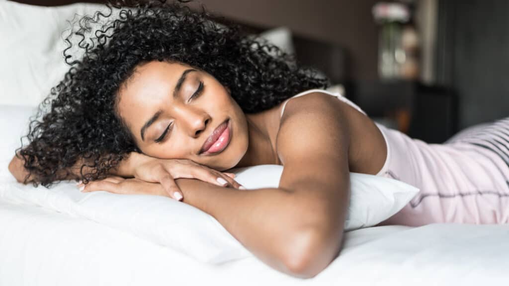 Beautiful black woman getting a good night's sleep.