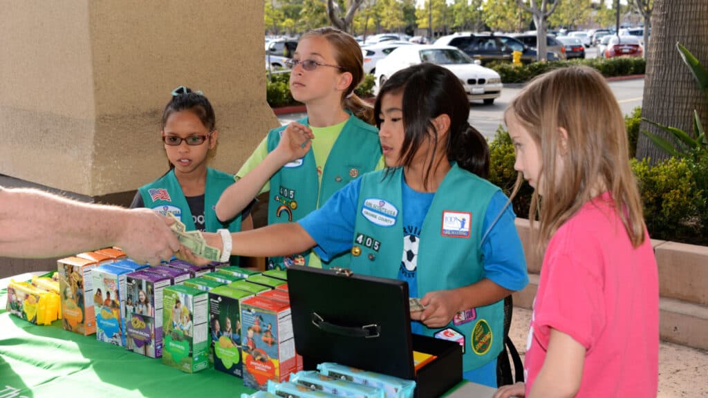 Girl Scouts selling cookies. 