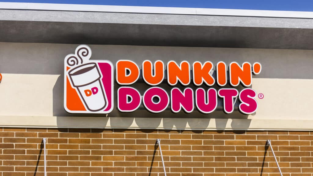 Dunkin' Donuts sign on building.