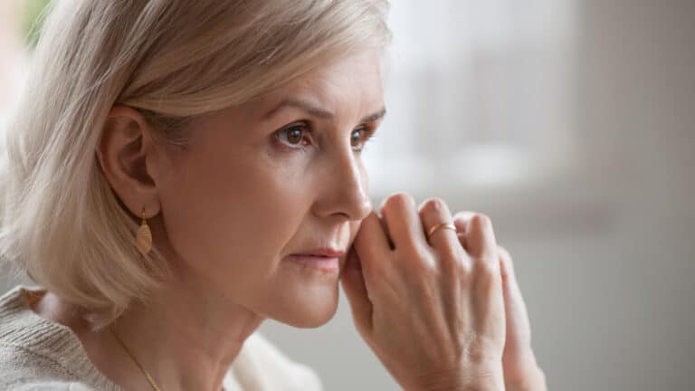 Thoughtful concerned older woman. Woman thinking.