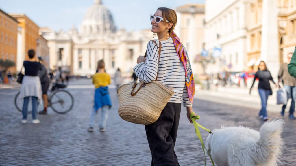Woman and dog walking in Italy.