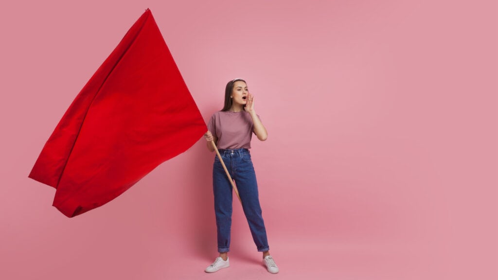 Woman holding red flag. 