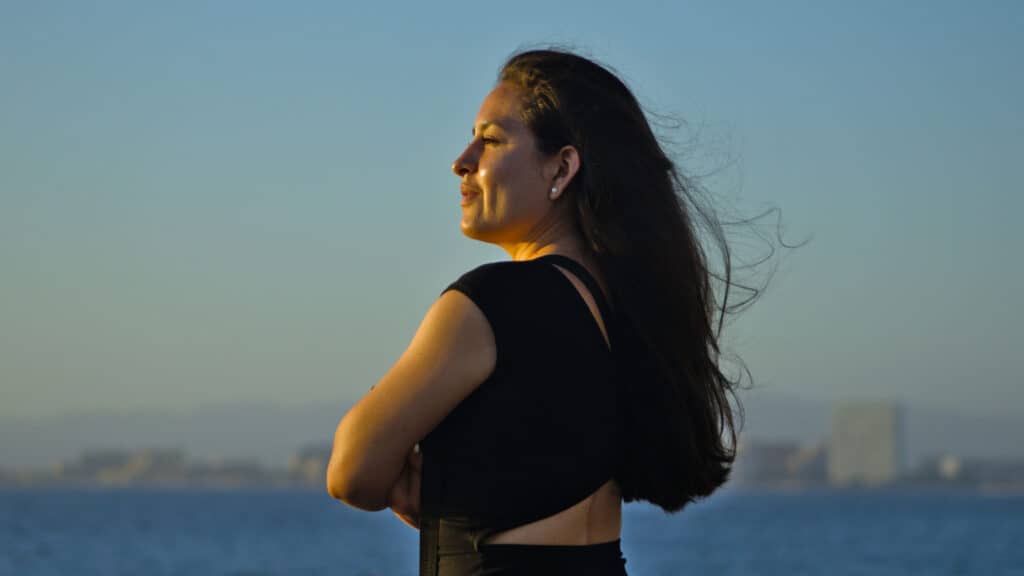 Woman watching sunset in Puerto Vallarta Mexico.