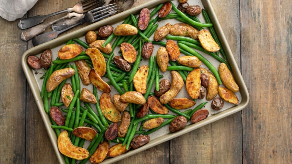 potatoes and green beans on sheet pan. 