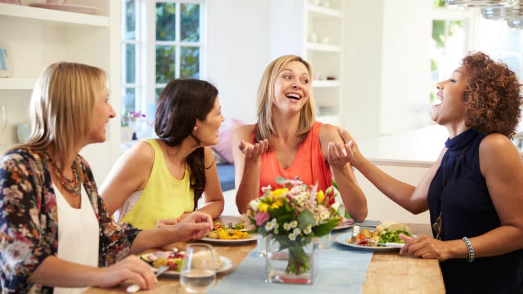 4 women eating together. Healthy food. I