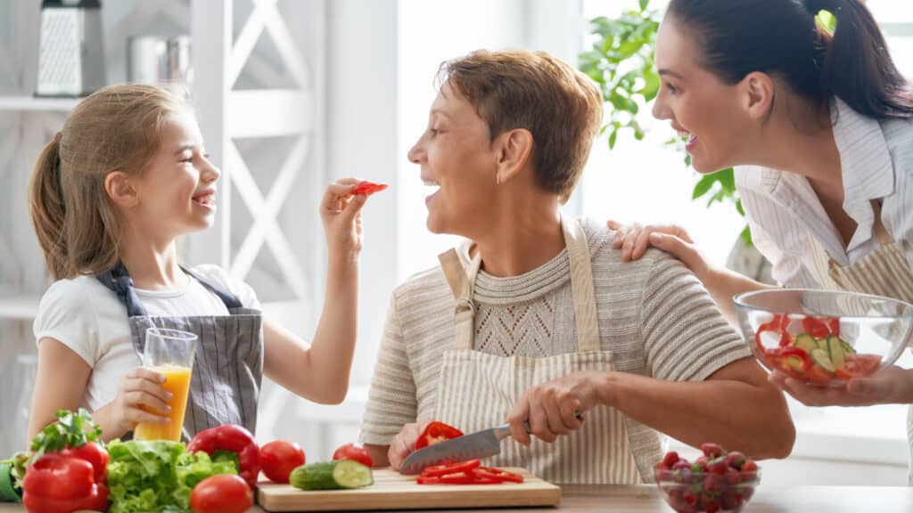 Family eating healthy meal. Cooking together.