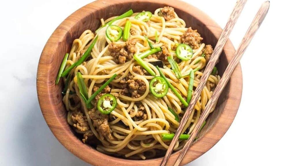 Pork-and-Noodles-in-wooden-bowl-with-chopsticks.