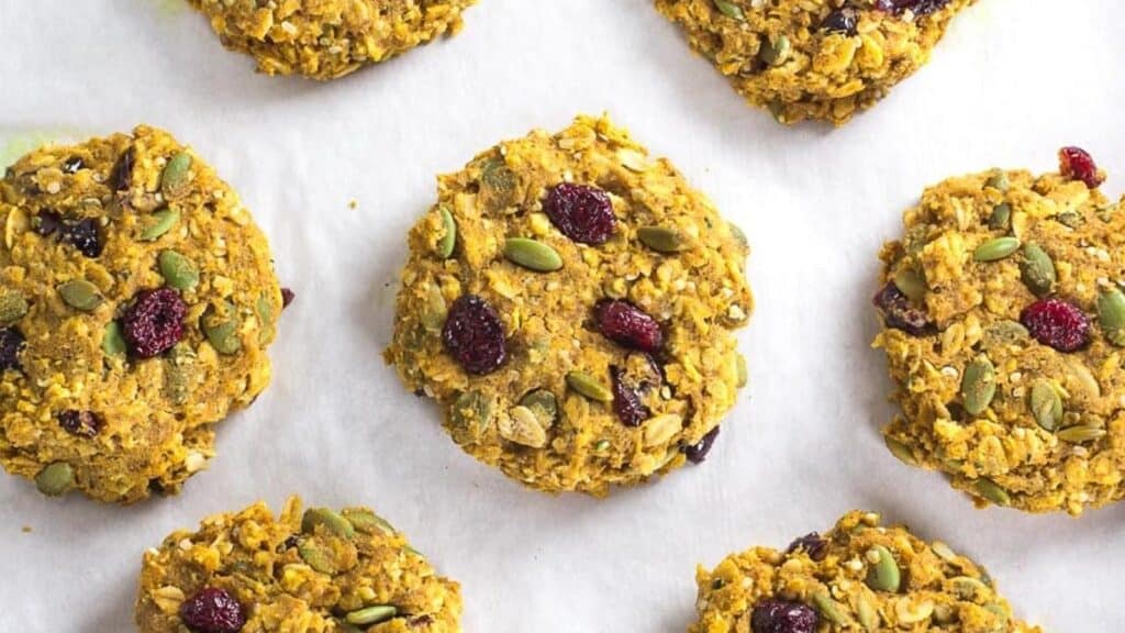 Low-FODMAP-Pumpkin-Cranberry-Oat-Breakfast-Cookies-on-pan-lined-with-parchment-paper.