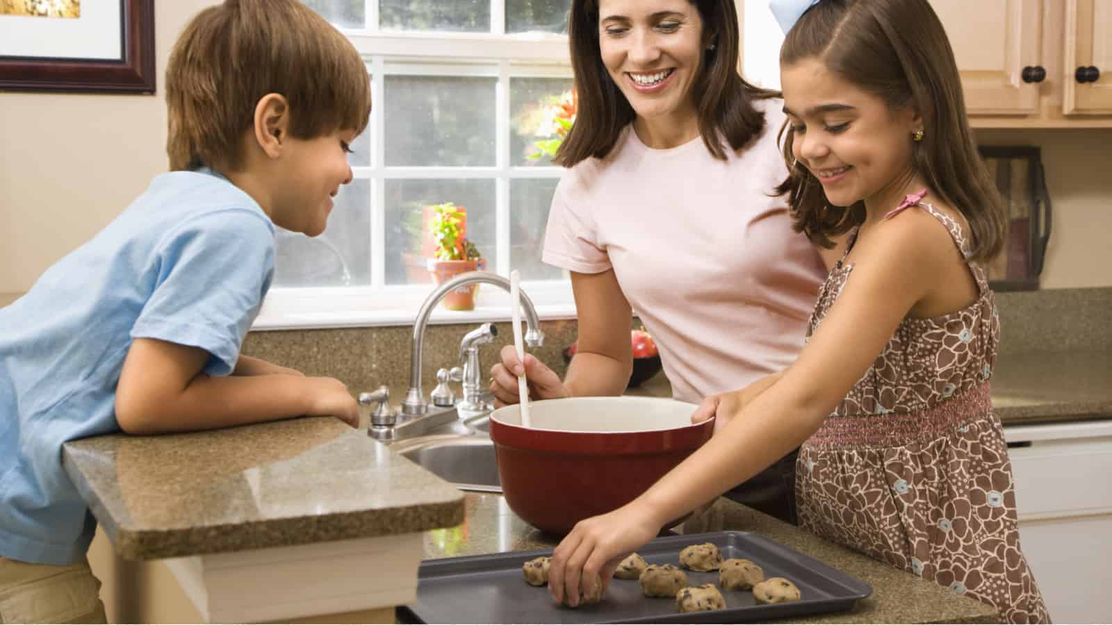 Mom and children making cookies.