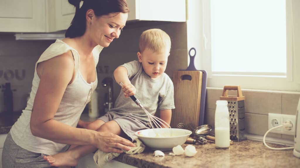 Mom cooking with toddler.