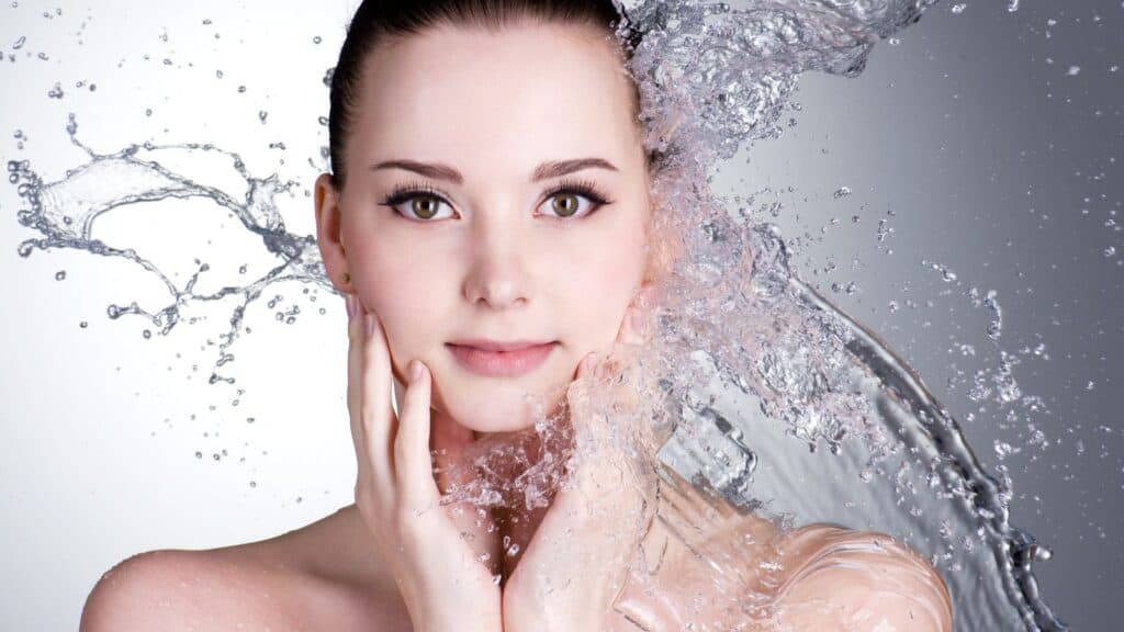 Woman being splashed with water.