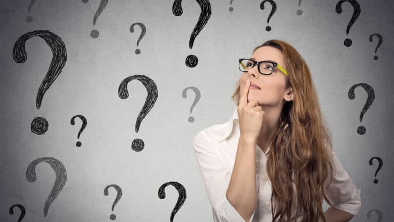 Woman asking questions. Wondering. Question marks.