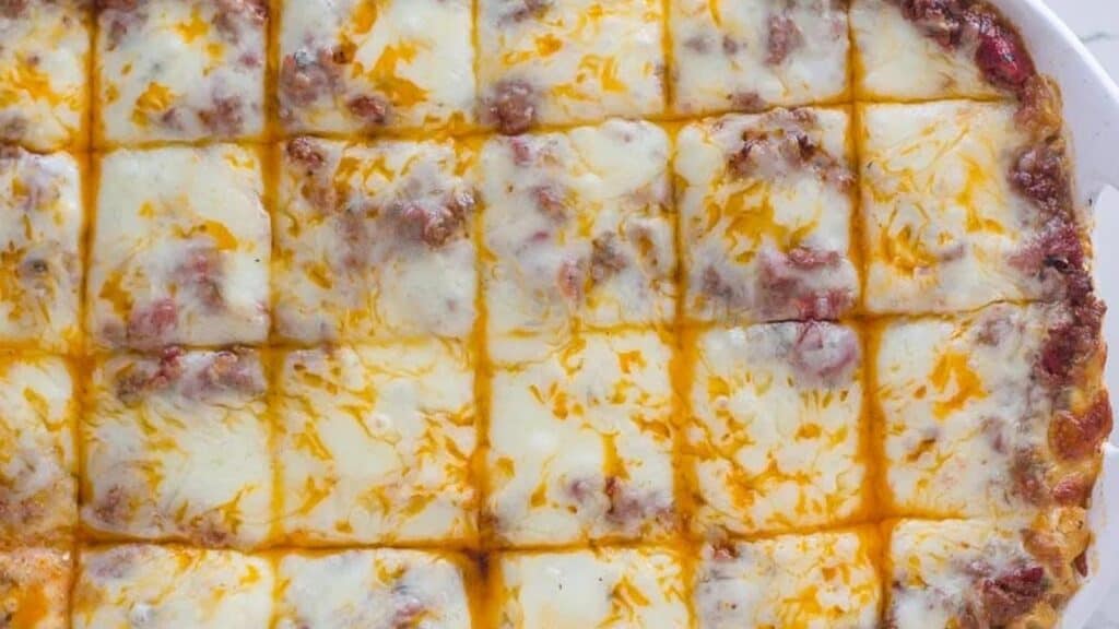 overhead-image-of-low-FODMAP-lasagna-in-white-dish-against-white-background.