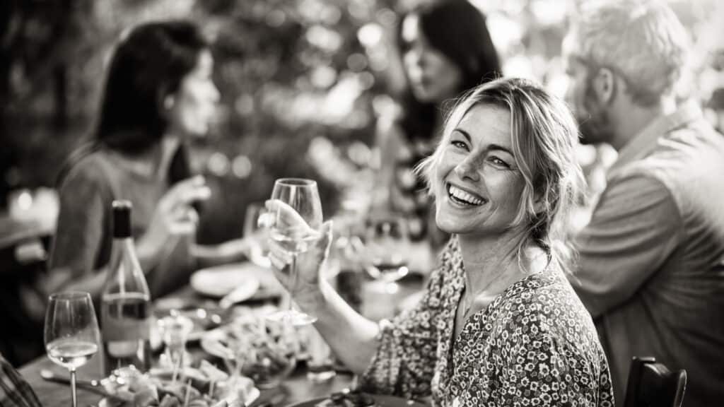 woman and friends dining al fresco.