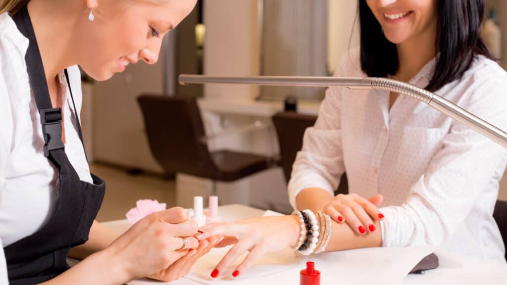 woman getting manicure.