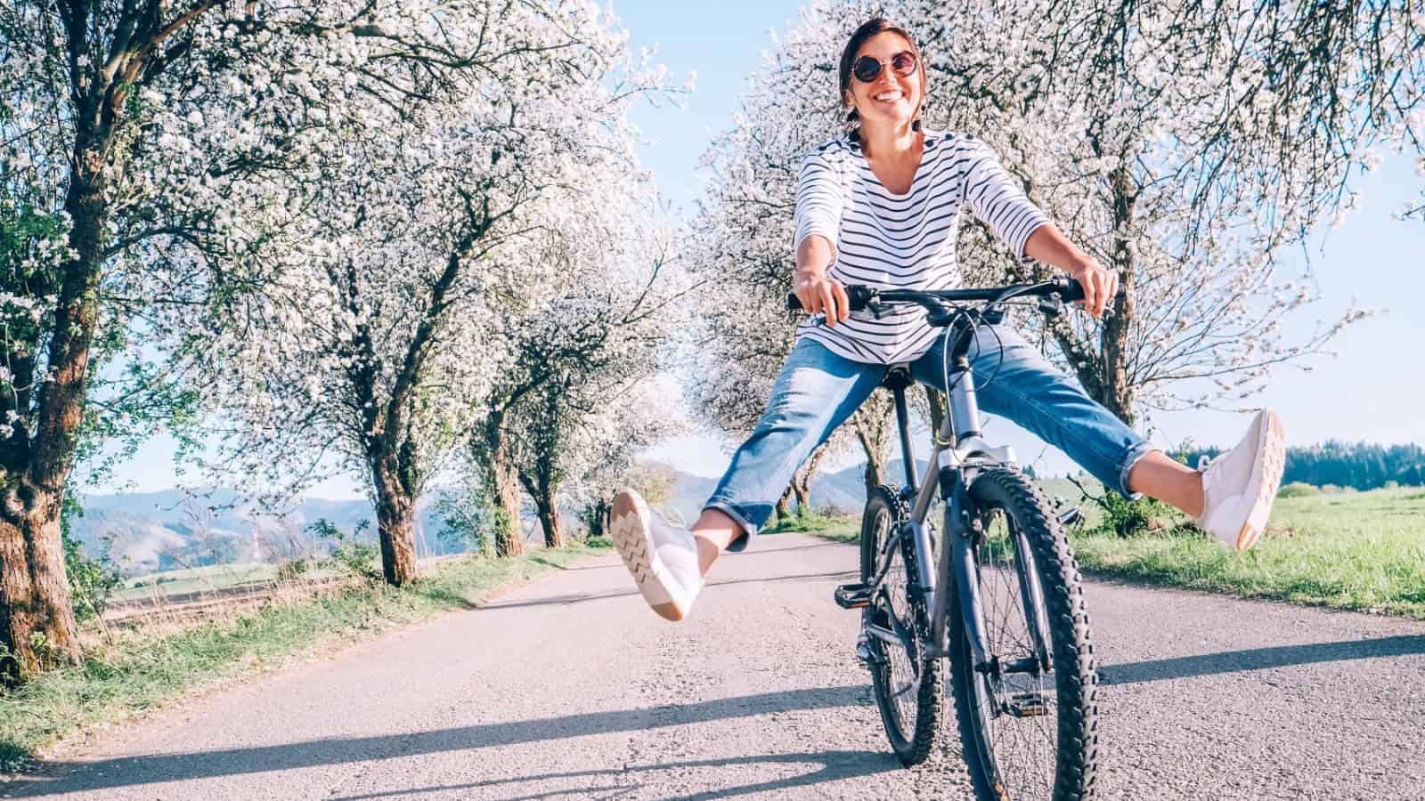 Happy woman riding bike.