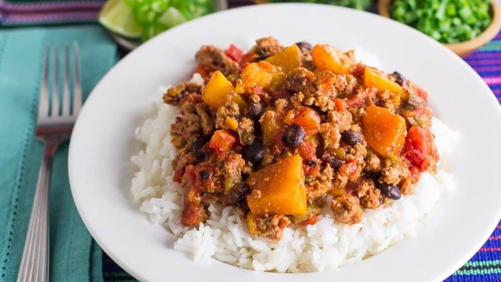 urkey-Chili-with-Winter-Squash-Beans-with-rice-in-a-white-bowl.