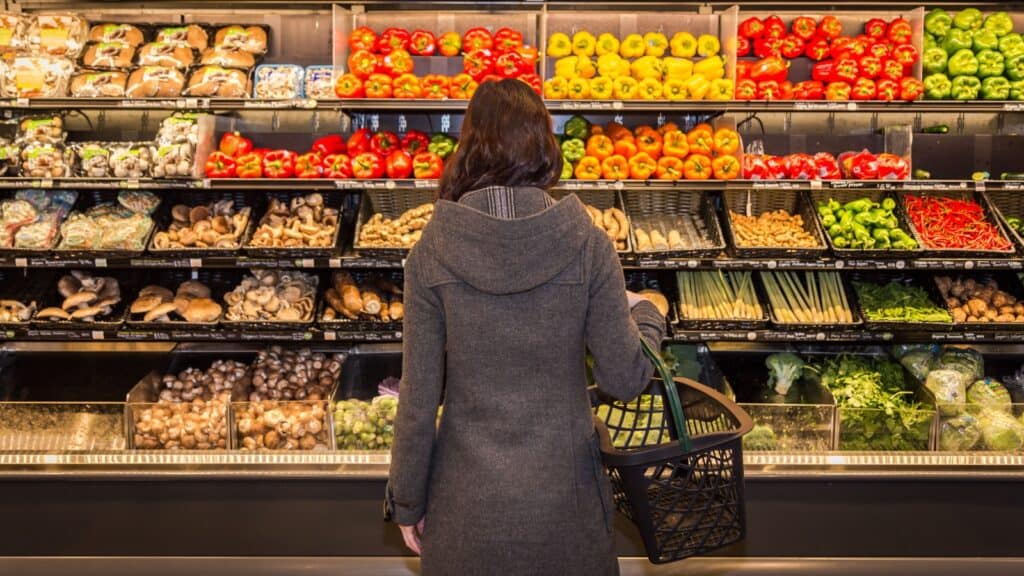 Woman looking at produce. 