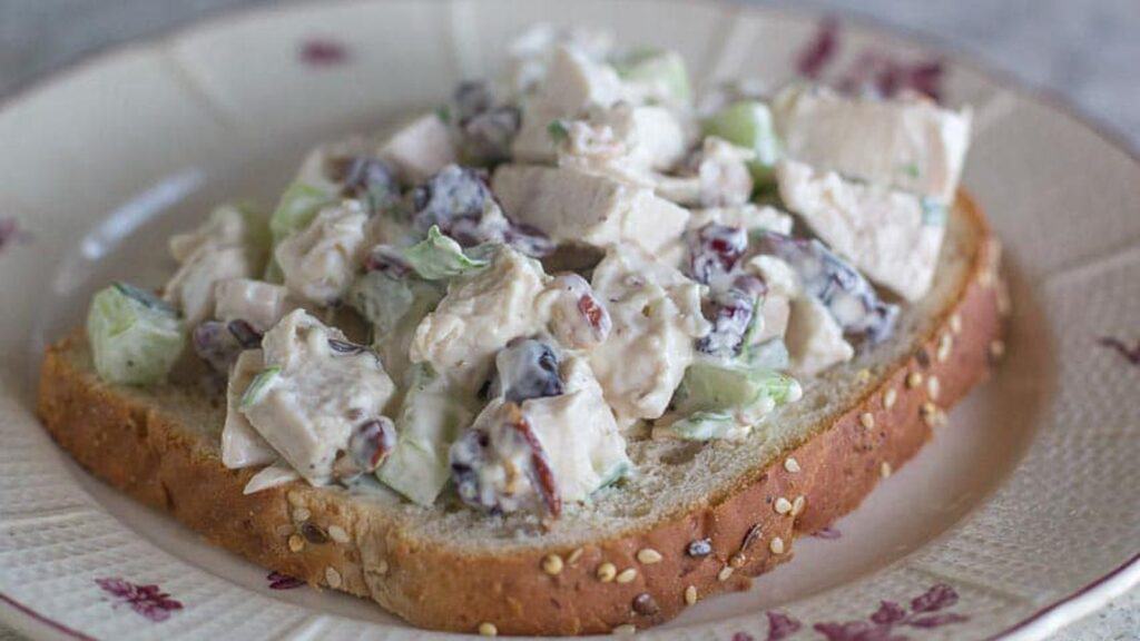 chicken-salad-with-cranberries-and-pecans-on-a-slie-of-bread.