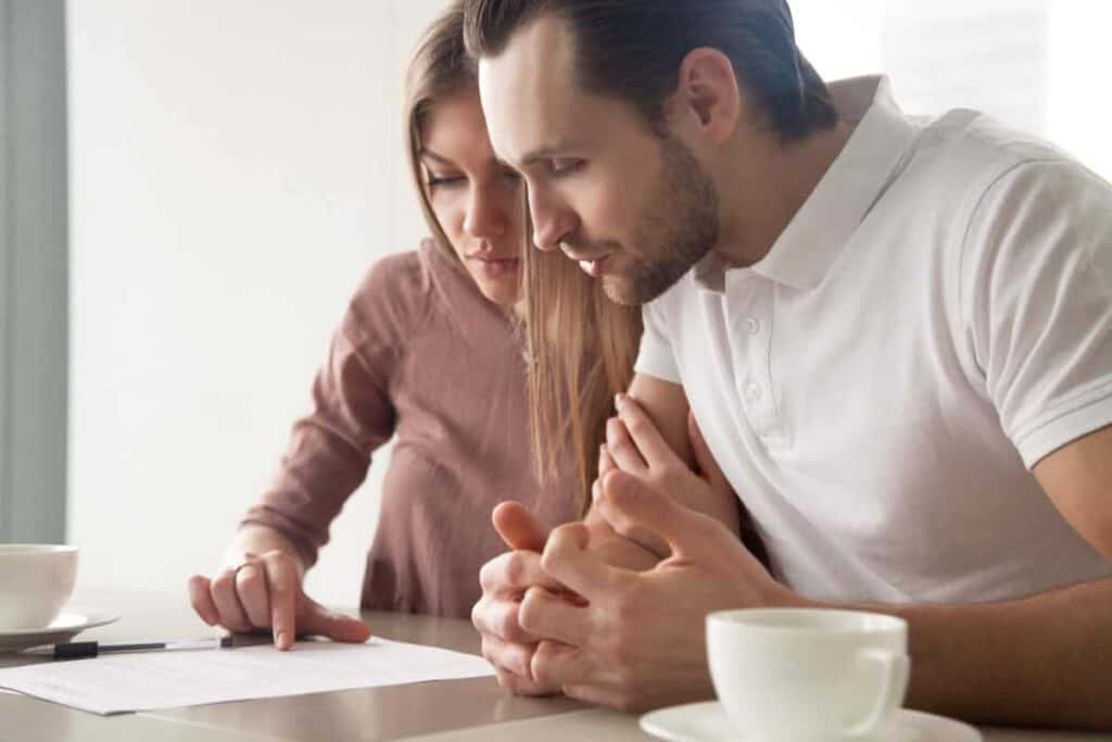 couple-looking-at-paperwork.-Shutterstock_626698901-Photo-credit-fizkes-Shutterstock