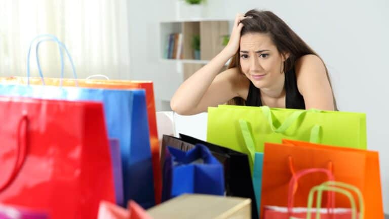 female shopper regretting purchases.