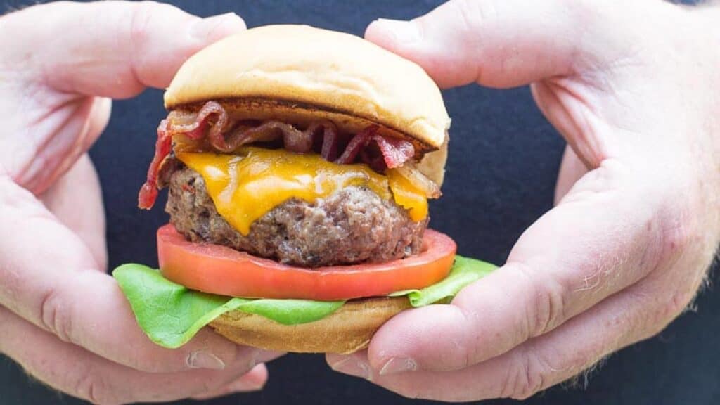 our-burger-in-hand.
