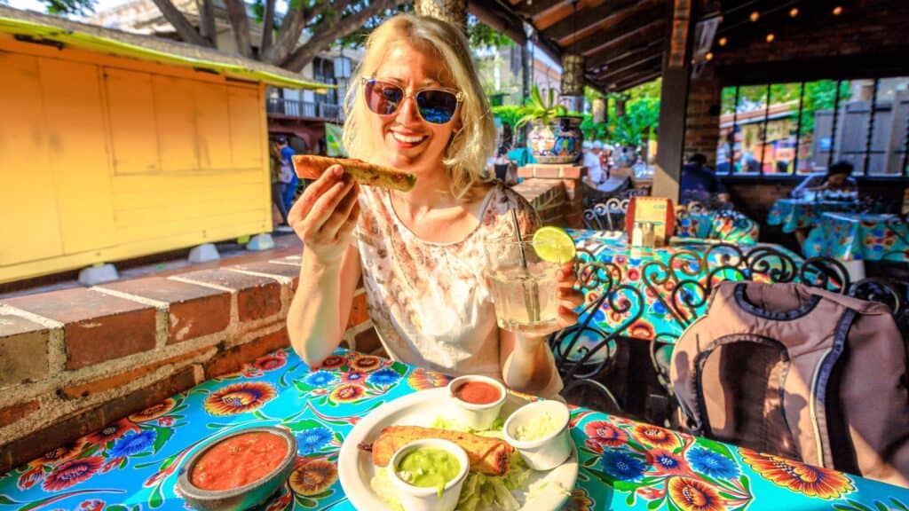 woman eating Mexican food.