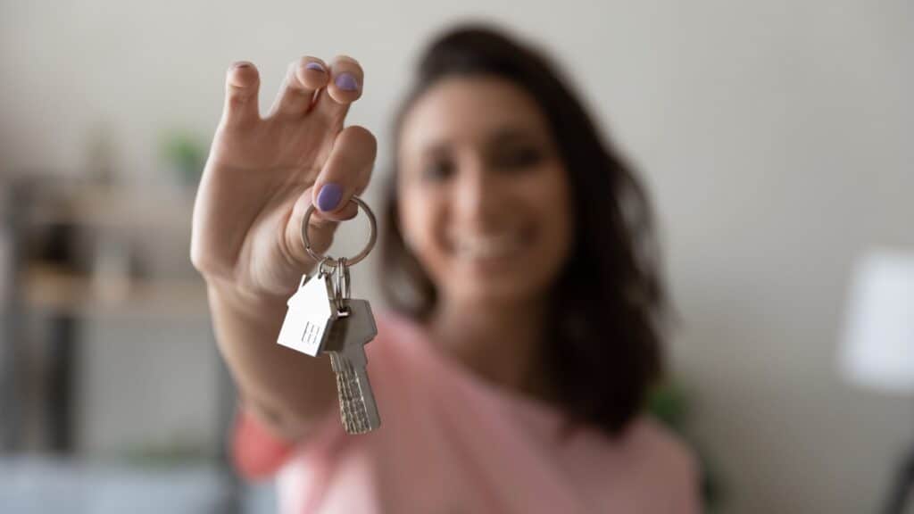 woman holding house keys. 