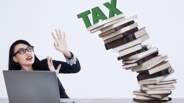 woman overwhelmed by taxes.