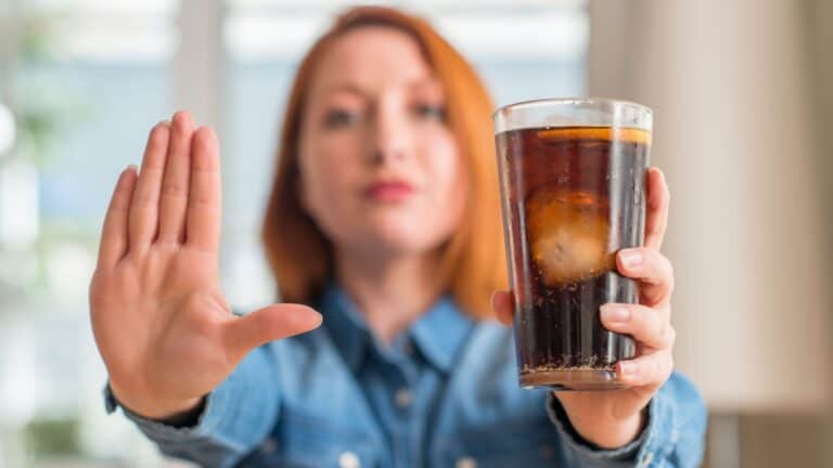 woman saying no to soda.