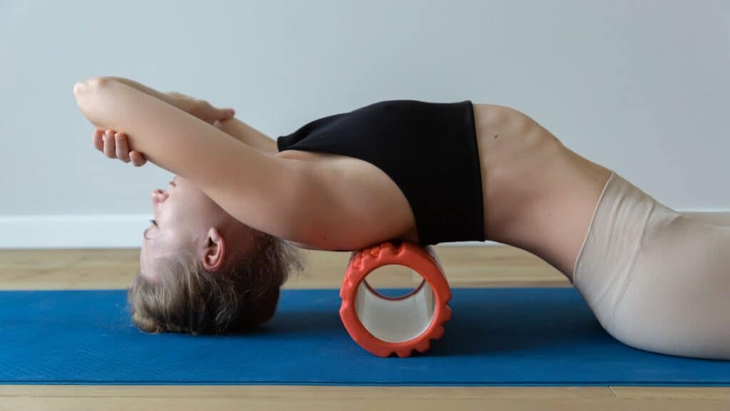 woman using exercise roller. 