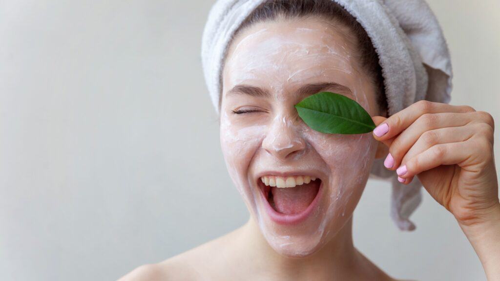 woman with face scrub on face. 