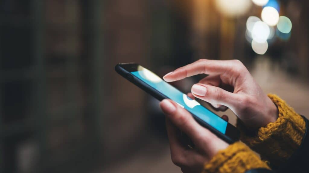 woman's hands using phone. 