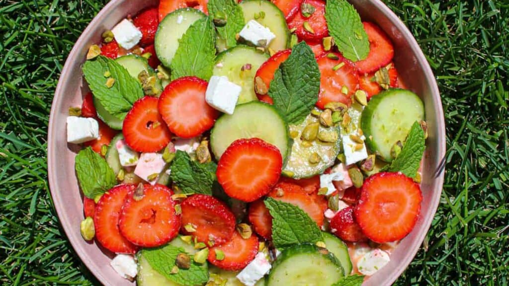 Bowl-of-Strawberry-Cucumber-Salad-in-Grass.