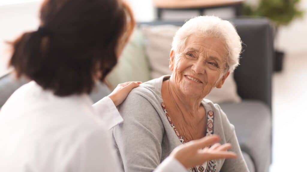 Older woman with young doctor.