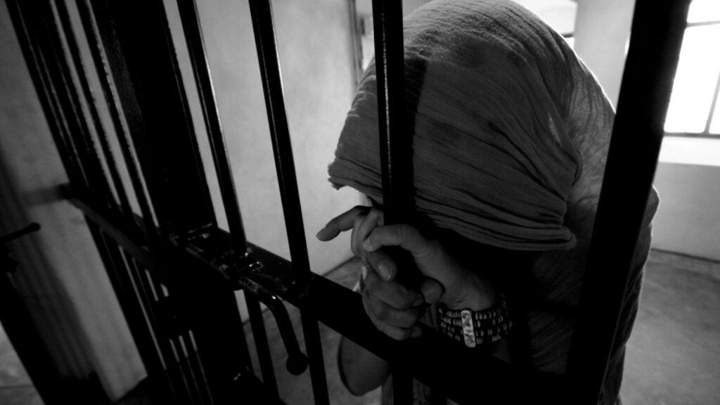 Girl behind bars