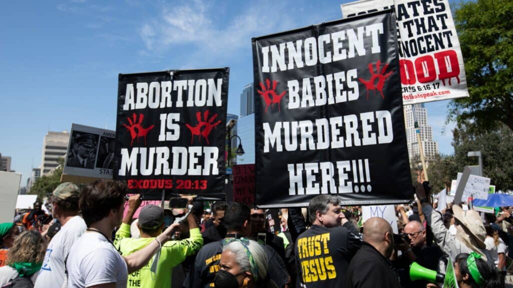 Los Angeles, California, USA - May 14, 2022: Anti abortion activists support the leaked Supreme Court opinion that would overturn Roe v Wade.abortion