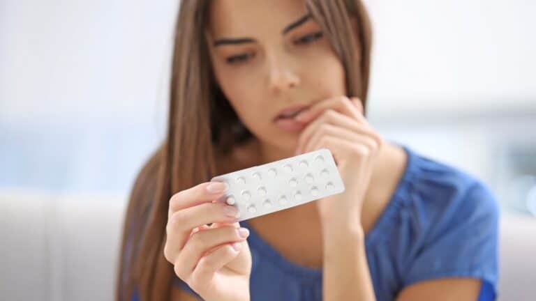 Woman with birth control pills.