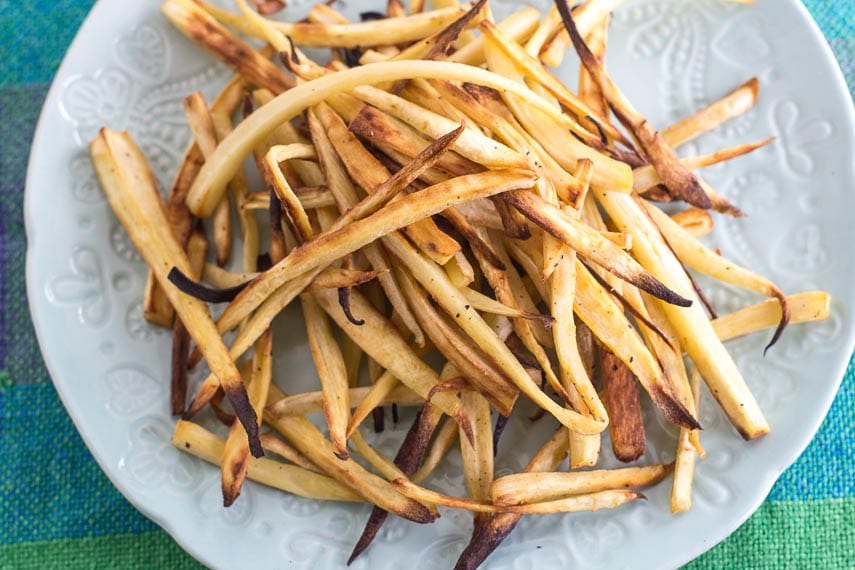parsnip-fries-on-white-plate-an-aqua-tablecloth.