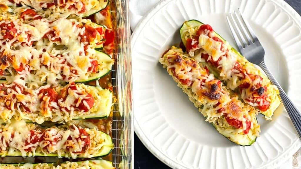 stuffed-zucchini-boats-in-glass-baking-dish-and-also-alongside-on-white-plate-with-fork.