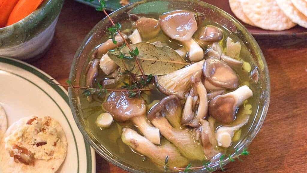 overhead-image-of-marinated-mushrooms-in-a-glass-bowl.