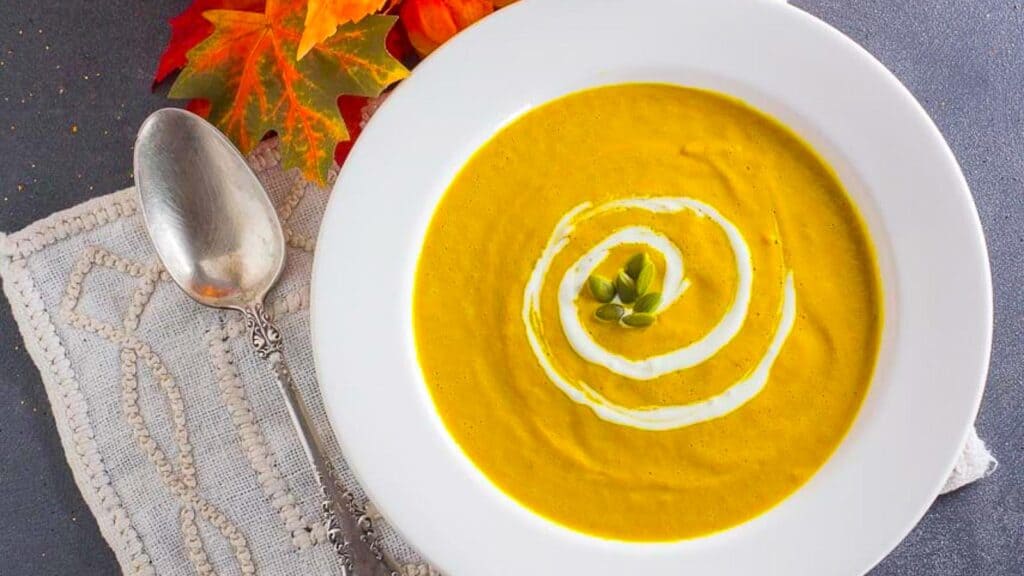 overhead-image-of-spicy-smoky-pumpkin-soup-in-white-bowl.