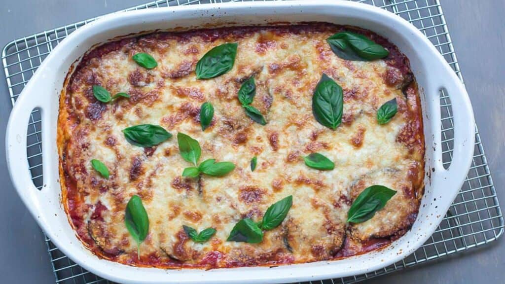 eggplant-parmigiana-in-white-casserole-on-cooling-rack.