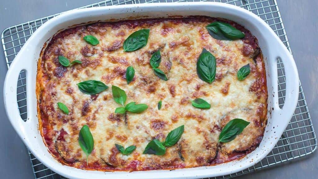 eggplant-parmigiana-in-white-casserole-on-cooling-rack.