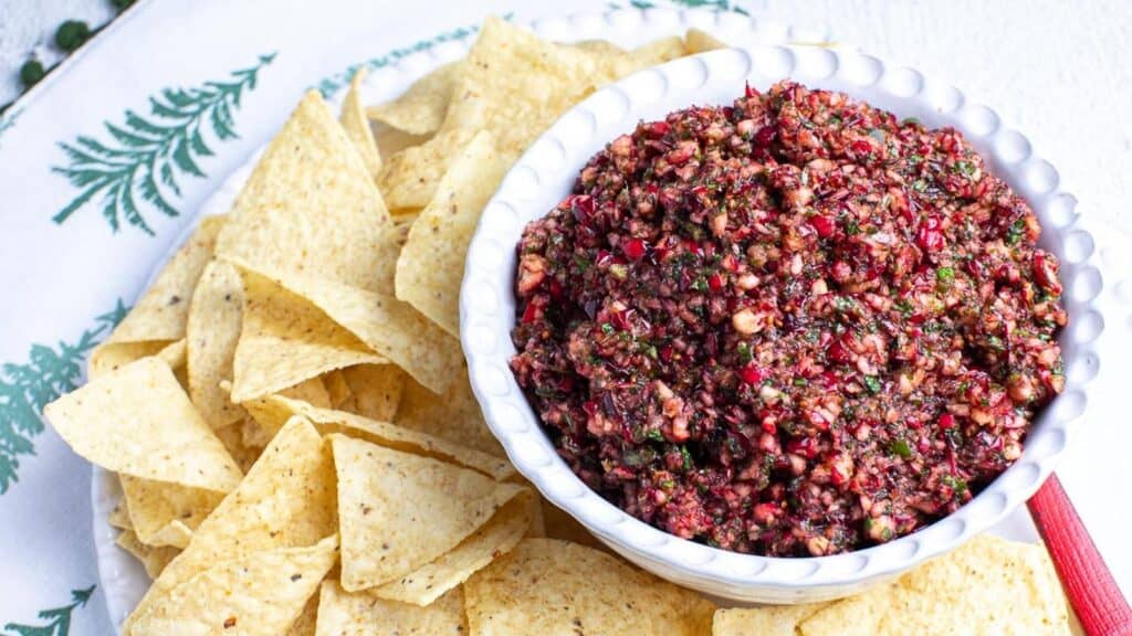white-bowl-holding-cranberry-salsa-chips-surrounding-bowl.