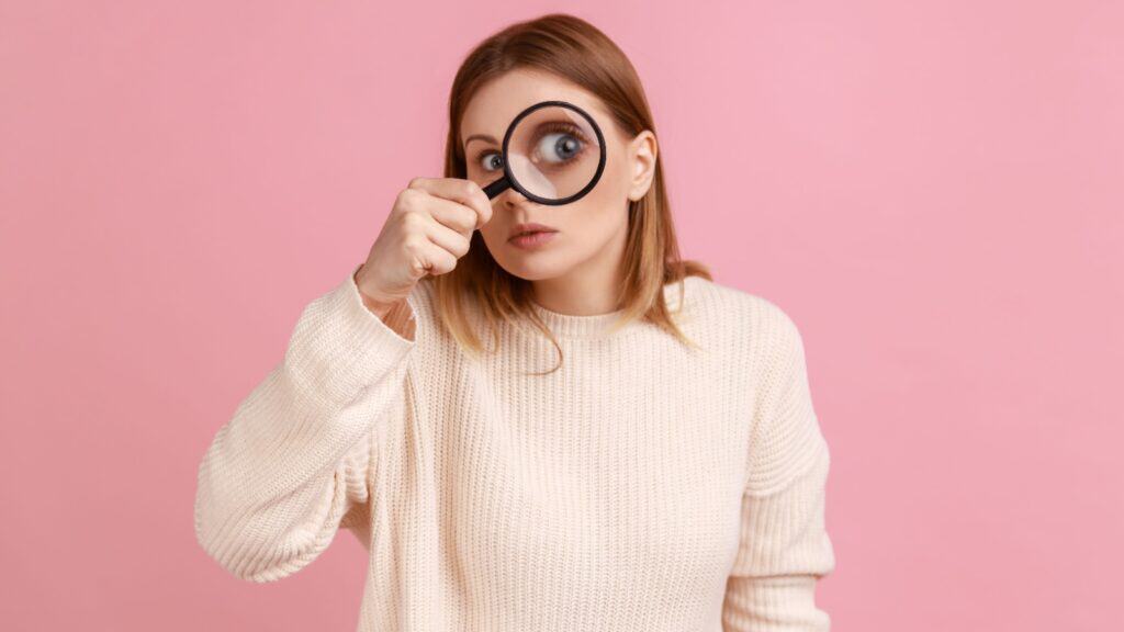 woman with magnifying glass. 