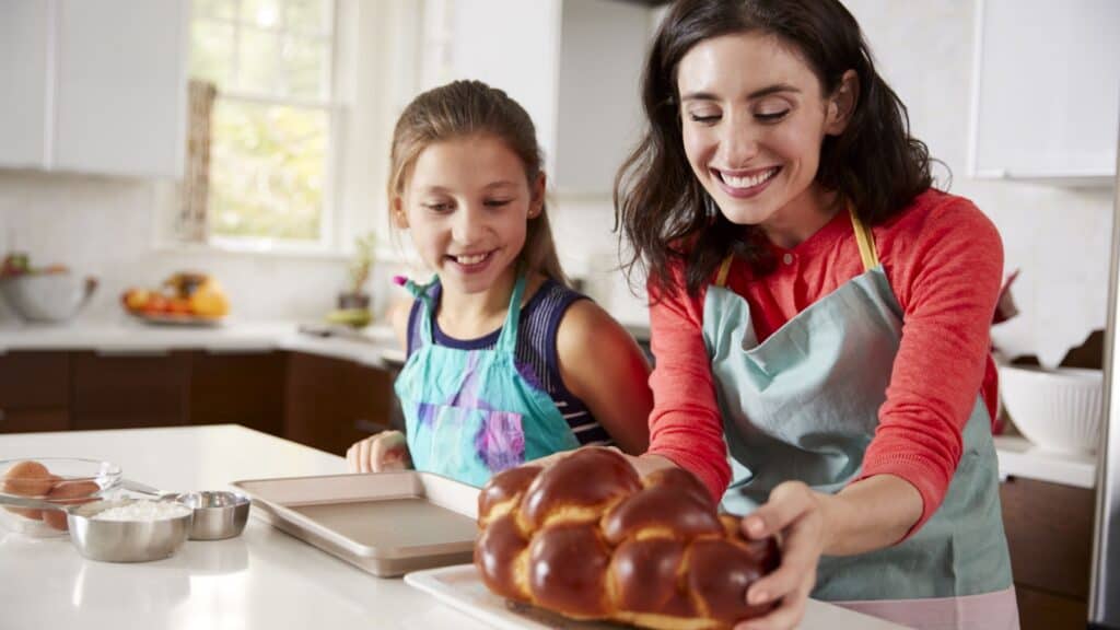 Baking challah. Mother and daughter. 