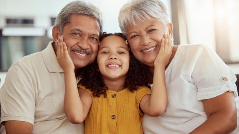 Grandparents and child. Image credit PeopleImages.com - Yuri A via Shutterstock.