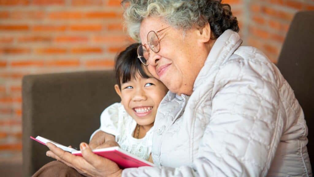 Patient grandma. reading to child. 