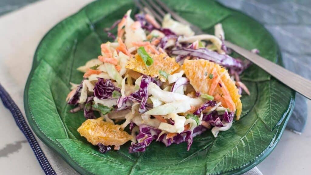 Citrus-Slaw-with-Creamy-Grapefruit-Dill-Dressing-on-green-plate.